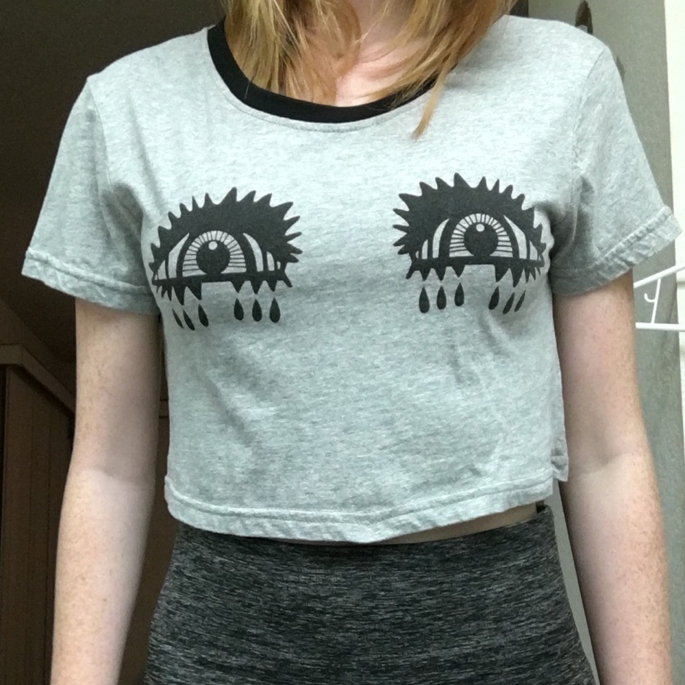 Grey shirt with eyes on chest